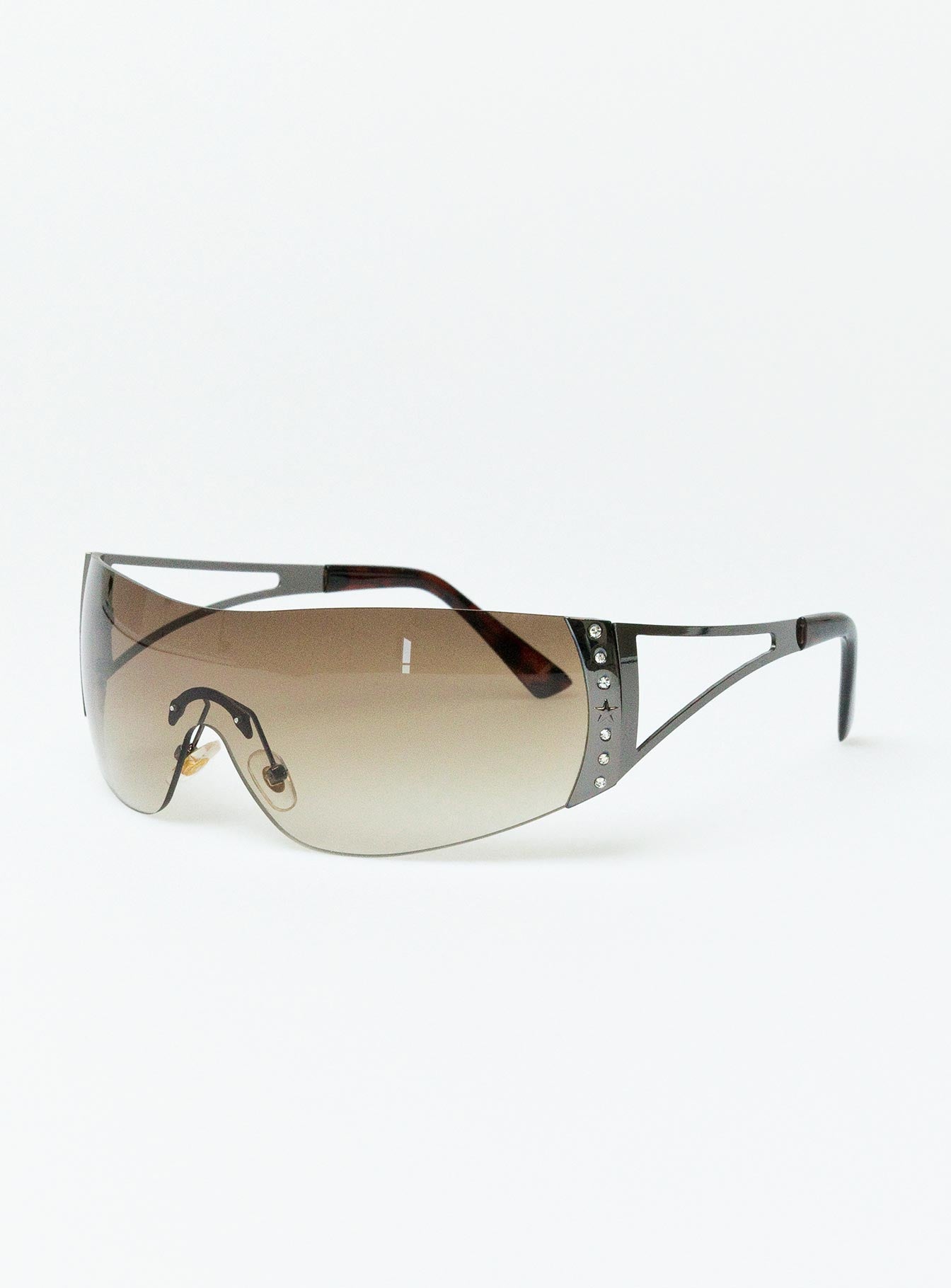 Sunglasses Frameless design Silver toned Silicone nose pads Diamante detail Clear lenses Lightweight