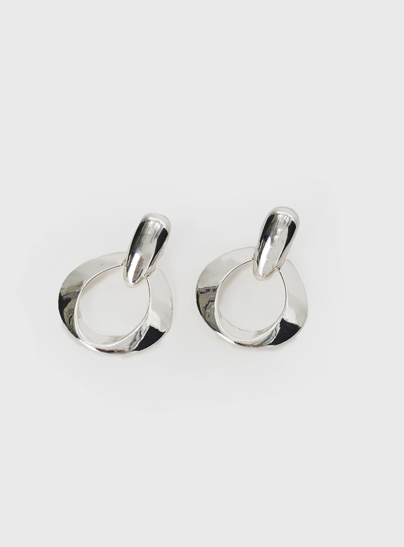 Silver-toned earrings Drop charm, stud fastening