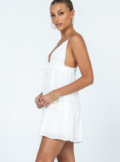side view of model wearing Princess Polly Dionne Mini Dress White Petite Plunger 