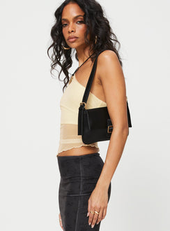 side view of model wearing Princess Polly Gilda Asymmetric Top Cream Sleeveless Asymmetric Neckline 