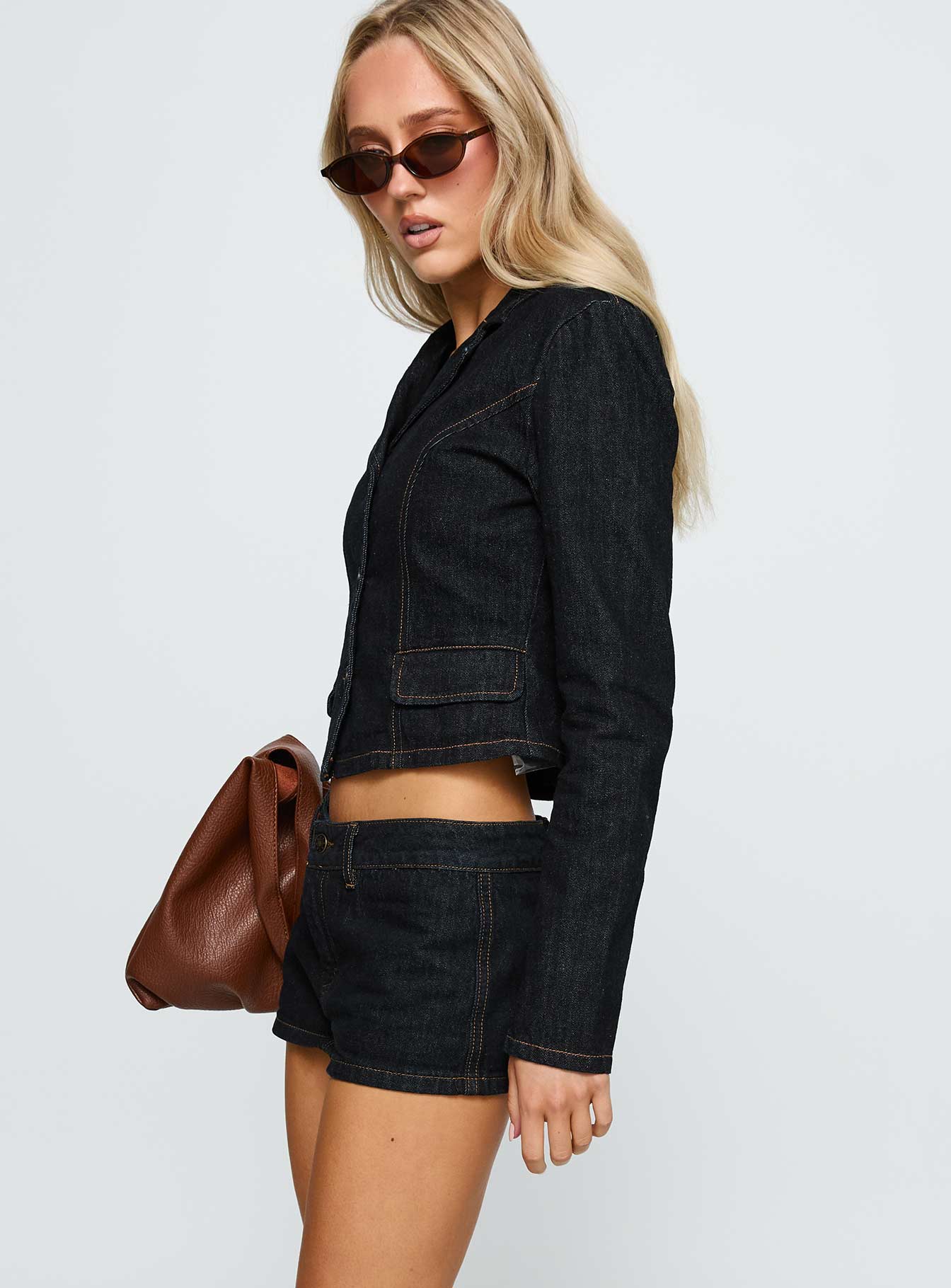 side view of model wearing Princess Polly Rhode Mini Skort Indigo Low Rise Shorts 