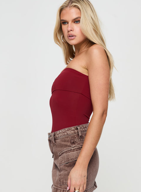 side view of model wearing Princess Polly Niner Strapless Bodysuit Burgundy Petite Sleeveless Bodysuit 