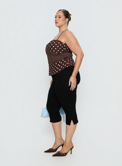 side view of model wearing Princess Polly Baseline Rib Capri Pants Black Curve Mid Rise Pants 