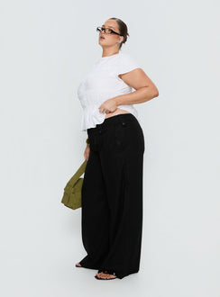 side view of model wearing Princess Polly Pedra Wide Leg Pant Black Curve Mid Rise Pants 