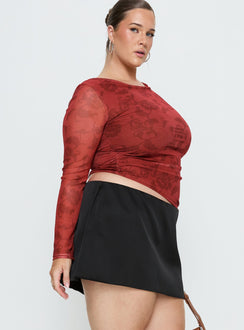   side view of model wearing Princess Polly Nadya Satin Tailored Mini Skirt Black Curve 