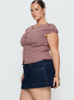   side view of model wearing Princess Polly Warna Low Rise Denim Mini Skirt Dark Wash Curve Mini Skirts 