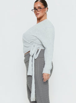 Designed with the Tonee Wrap Knit Cardigan Grey Curve in a short length womens jumper with v-neck and oversized fit side view of model wearing Princess Polly