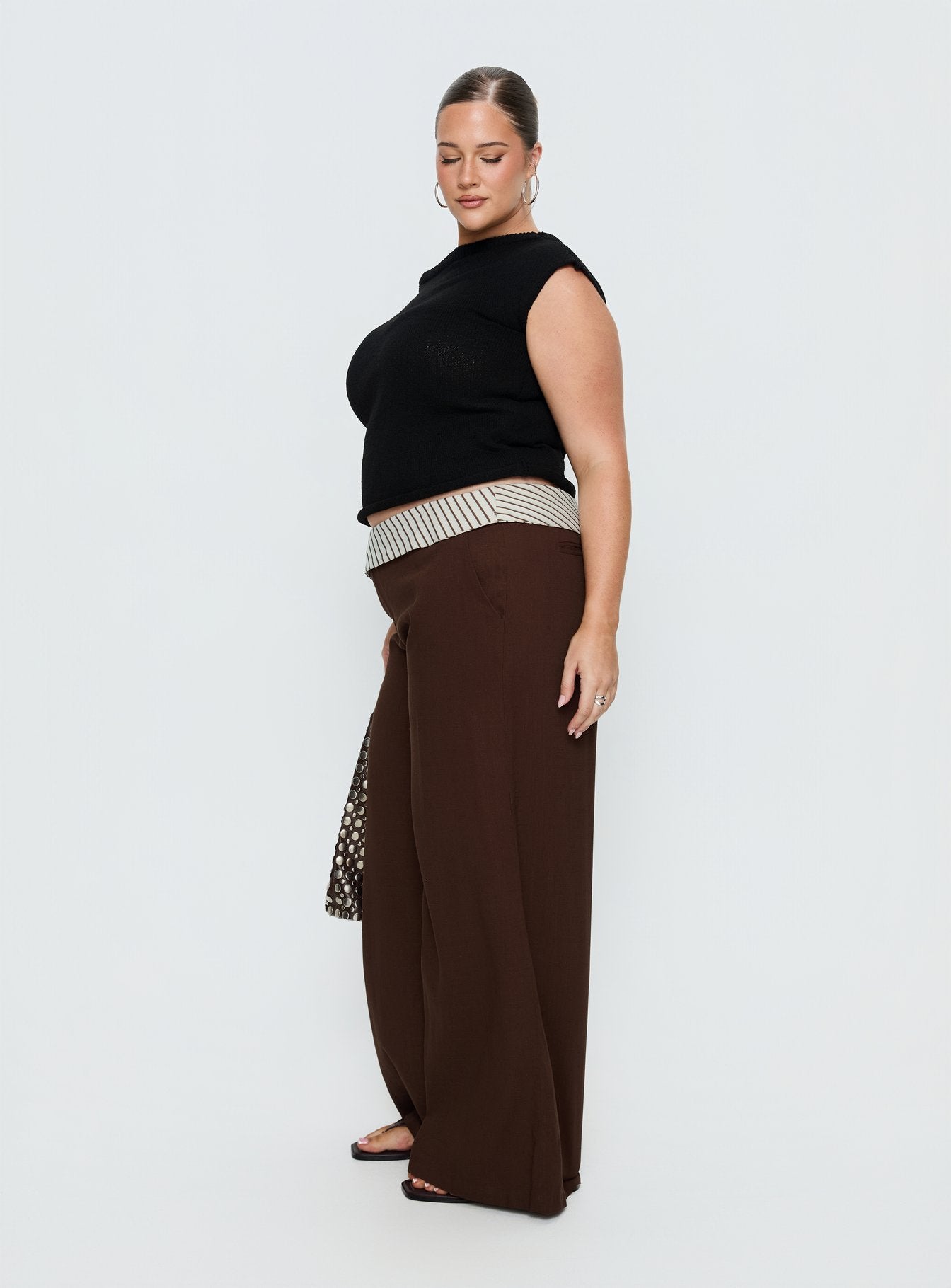 side view of model wearing Princess Polly Past Life Fold Over Waistband Pant Brown / Stripe Curve Mid Rise Pants 