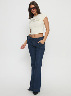 front view of model wearing Princess Polly Acapulco Low Rise Flare Jeans Dark Blue Wash Low Rise Jeans Jeans 