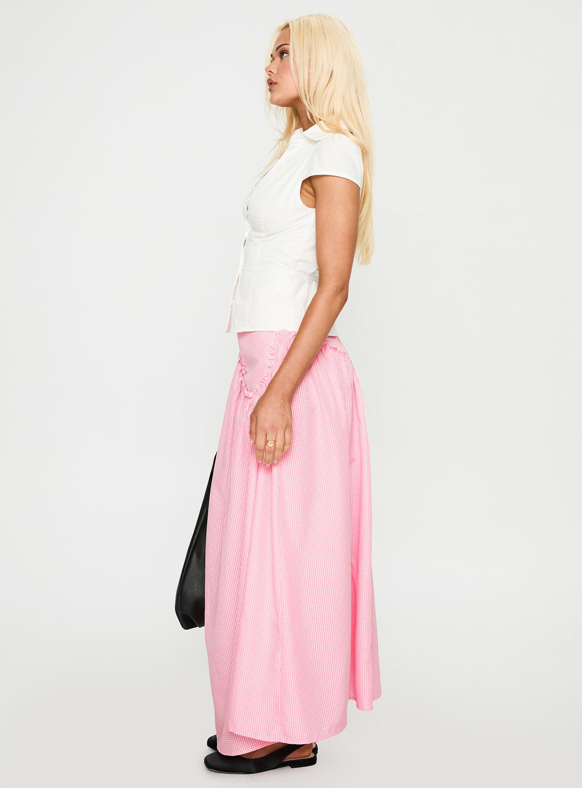   side view of model wearing Princess Polly Apresia Maxi Skirt Pink Gingham Maxi 