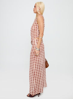   side view of model wearing Princess Polly Surina Skirt Peach Check Maxi 