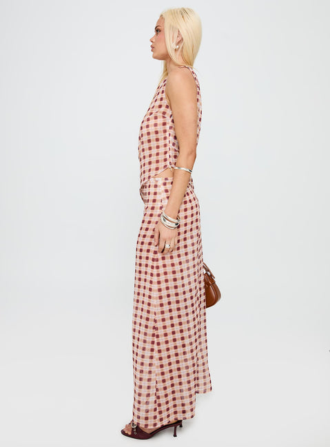  side view of model wearing Princess Polly Surina Skirt Peach Check Maxi 