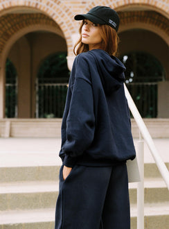 side view of model wearing Princess Polly Dream Fleece Classic Hoodie Navy Longline Jumpers Jumpers 