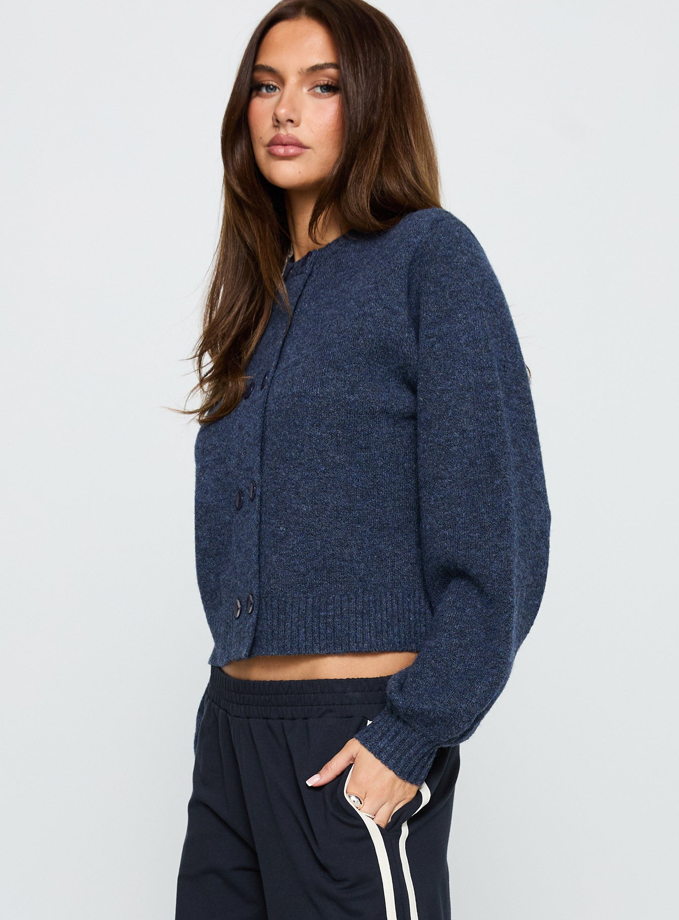 Featuring the Kammi Button Up Cardigan Navy in womens jumpers with short length side view of model wearing Princess Polly