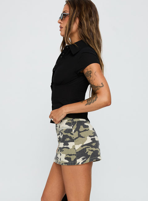   side view of model wearing Princess Polly Voltage Denim Mini Skirt Camouflage 