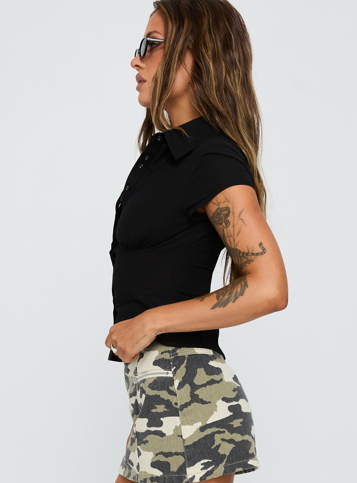 back view of model wearing Princess Polly Cottesloe Blouse Top Textured Black Short Sleeves V-Neck 