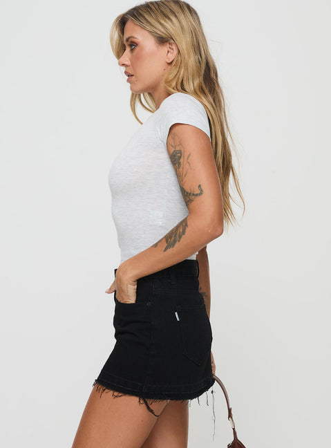  side view of model wearing Princess Polly Aster Mini Skirt Black Mini Skirts 