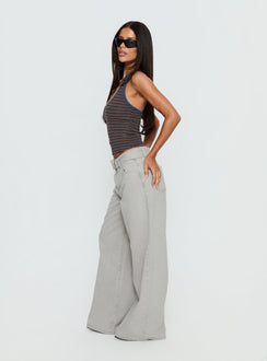 side view of model wearing Princess Polly Katlin Mid Rise Wide Leg Buckle Detail Jeans Grey Wash Mid Rise Jeans 