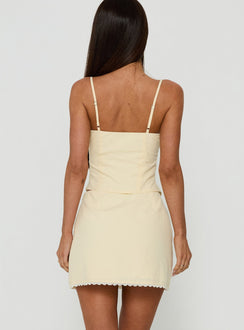 Crafted with Noria Lace Trim Mini Skirt Yellow womens-skirts in a fitted a-line silhouette with solid pattern back view of model wearing
