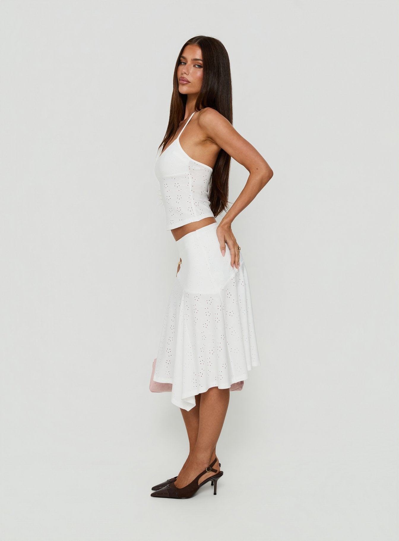 Designed with the Opalie Asymmetrical Midi Skirt White Broderie in womens-skirts highlighting fitted silhouette side view of model wearing Princess Polly