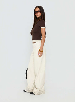 side view of model wearing Princess Polly Nikoletta Foldover Jeans Cream / Polka Mid Rise Jeans 