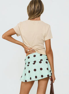 back view of model wearing Princess Polly Elicia Ruched Mini Skirt Mint / Chocolate Polka Dot Mini Skirts 