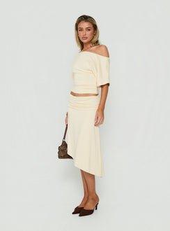 Discover the Sezzia Ruched Asymmetrical Midi Skirt Beige womens-skirts crafted with fitted design and length side view of model wearing Princess Polly