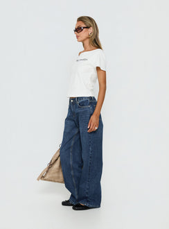 side view of model wearing Princess Polly Serenitia Mid Rise Straight Leg Relaxed Jeans Dark Blue Wash Mid Rise Jeans 