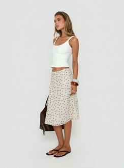 Crafted from the Olila Sequin Midi Skirt White Polka Dot womens-skirts in midi length side view of model wearing Princess Polly