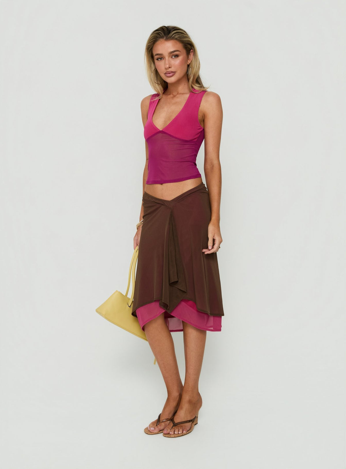 Introducing the Erinhadi Midi Skirt Brown / Pink womens-skirts with midi length side view of model wearing Princess Polly