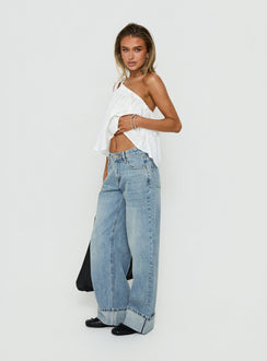 Capturing the Serenitia Mid Rise Relaxed Cuff Jeans Light Vintage Wash womens-jeans side view of model wearing Princess Polly