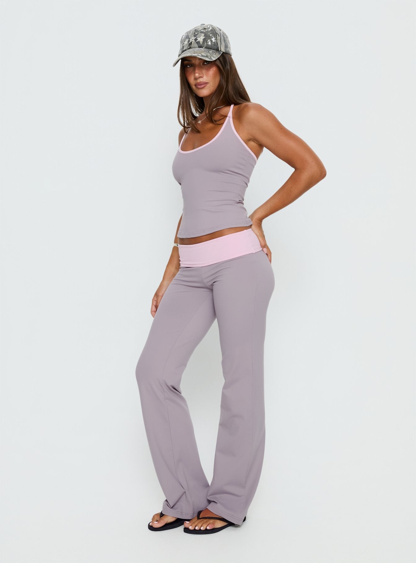 side view of model wearing Princess Polly Kobee Jersey Flare Pants Slate / Dusty Pink Mid Rise Pants 