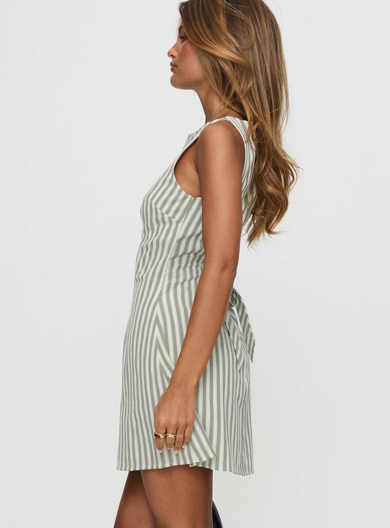 side view of model wearing Princess Polly Alfalfa Shift Mini Dress Green Stripe Boat Neck 