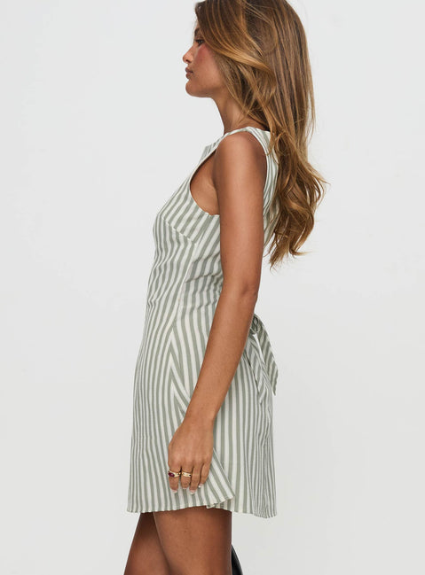 side view of model wearing Princess Polly Alfalfa Shift Mini Dress Green Stripe Boat Neck 