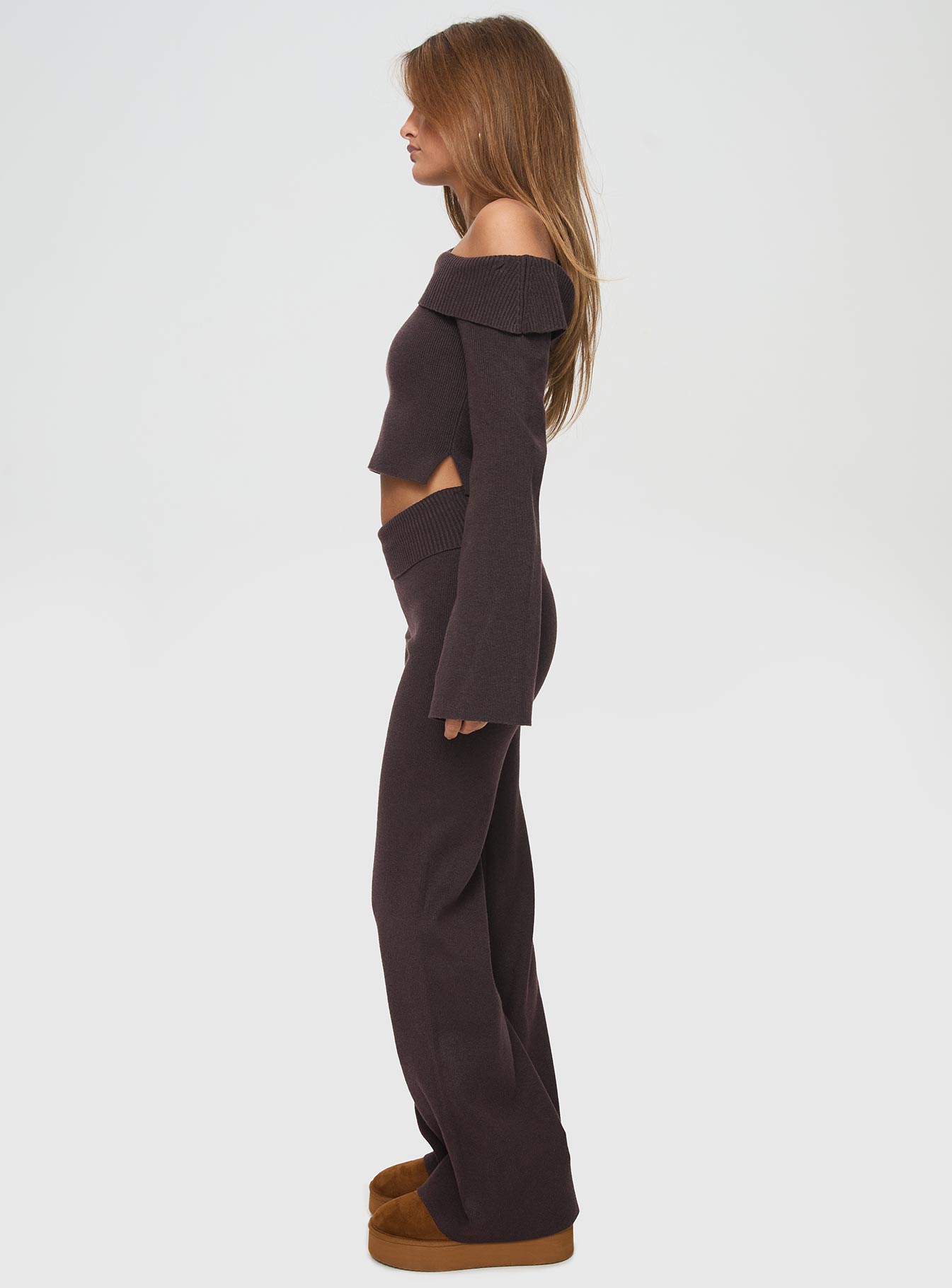 side view of model wearing Princess Polly Sina Off The Shoulder Top Chocolate Tall Full Sleeves Asymmetric Neckline 