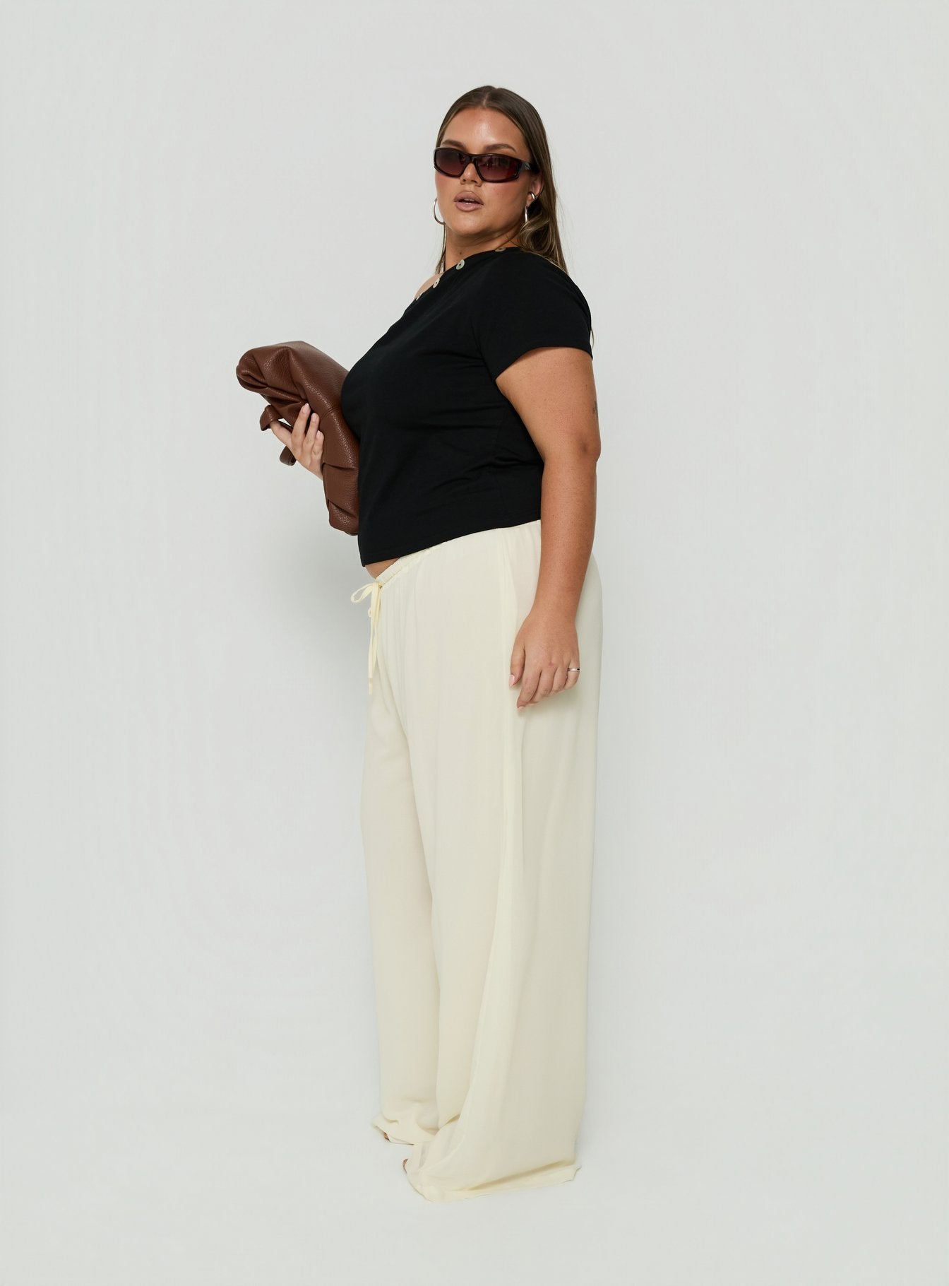 Designed with Finesse Pants Yellow Curve womens-regular-pants mid-rise side view of model wearing