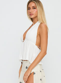 side view of model wearing Princess Polly Saddler Halter Top White Sleeveless Plunger 