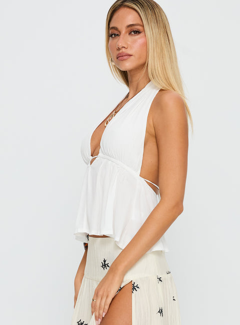 side view of model wearing Princess Polly Saddler Halter Top White Sleeveless Plunger 