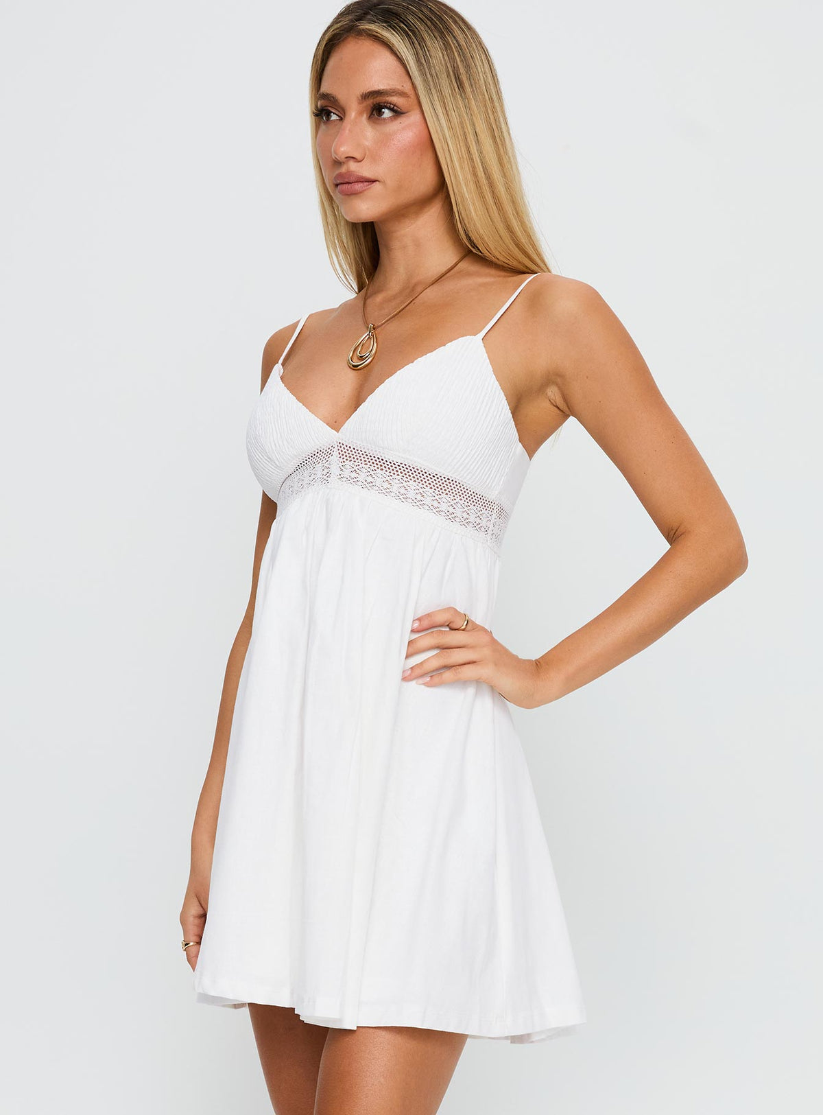 side view of model wearing Princess Polly Bodee Mini Dress White V-Neck 