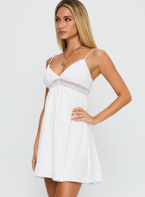 side view of model wearing Princess Polly Bodee Mini Dress White V-Neck 