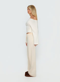 side view of model wearing Princess Polly Felisha Low Waist Knit Pants White Mid Rise Pants 