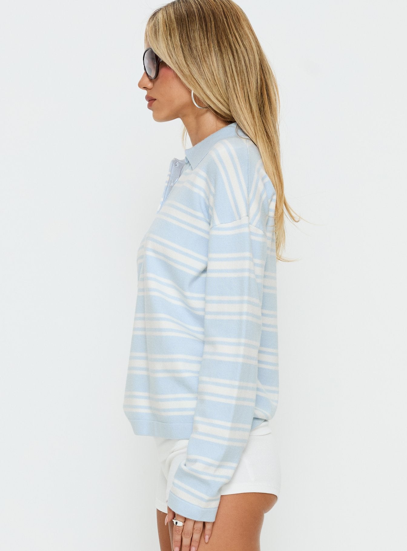 side view of model wearing Princess Polly Kerrey Collared Rugby Jersey Blue Stripe 