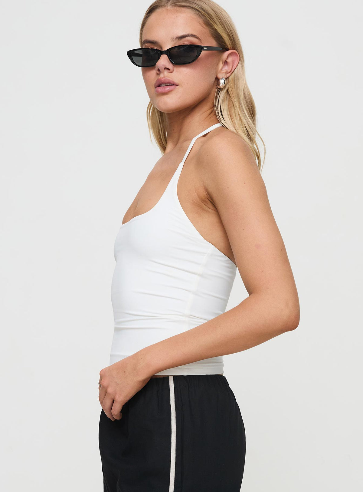 side view of model wearing Princess Polly Ezekiel Nylon Top White Sleeveless Square Neck 