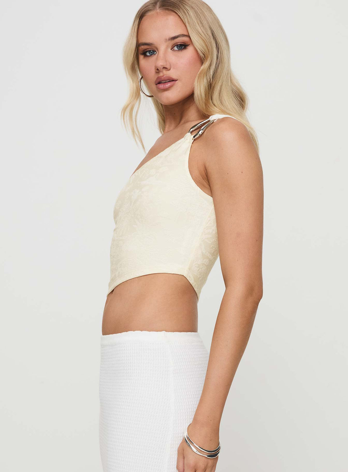 side view of model wearing Princess Polly Toomba One Shoulder Top Ivory Sleeveless Asymmetric Neckline 