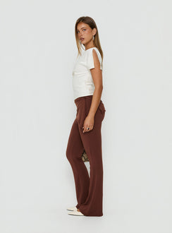 Crafted from sienna fabric the Masimo Layered Pants Chocolate womens regular pants feature high-rise and wide-leg styling side view of model wearing Princess Polly