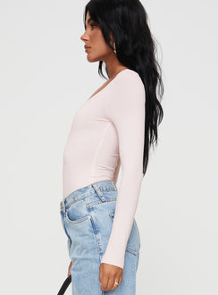 side view of model wearing Princess Polly Delgado Long Sleeve Bodysuit Pink Long Sleeve Tops 