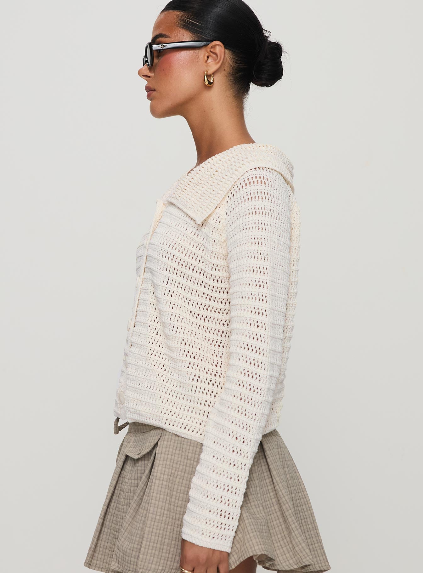Crafted from the Tuscon Crochet Sweater White womens-jumpers featuring short length side view of model wearing Princess Polly