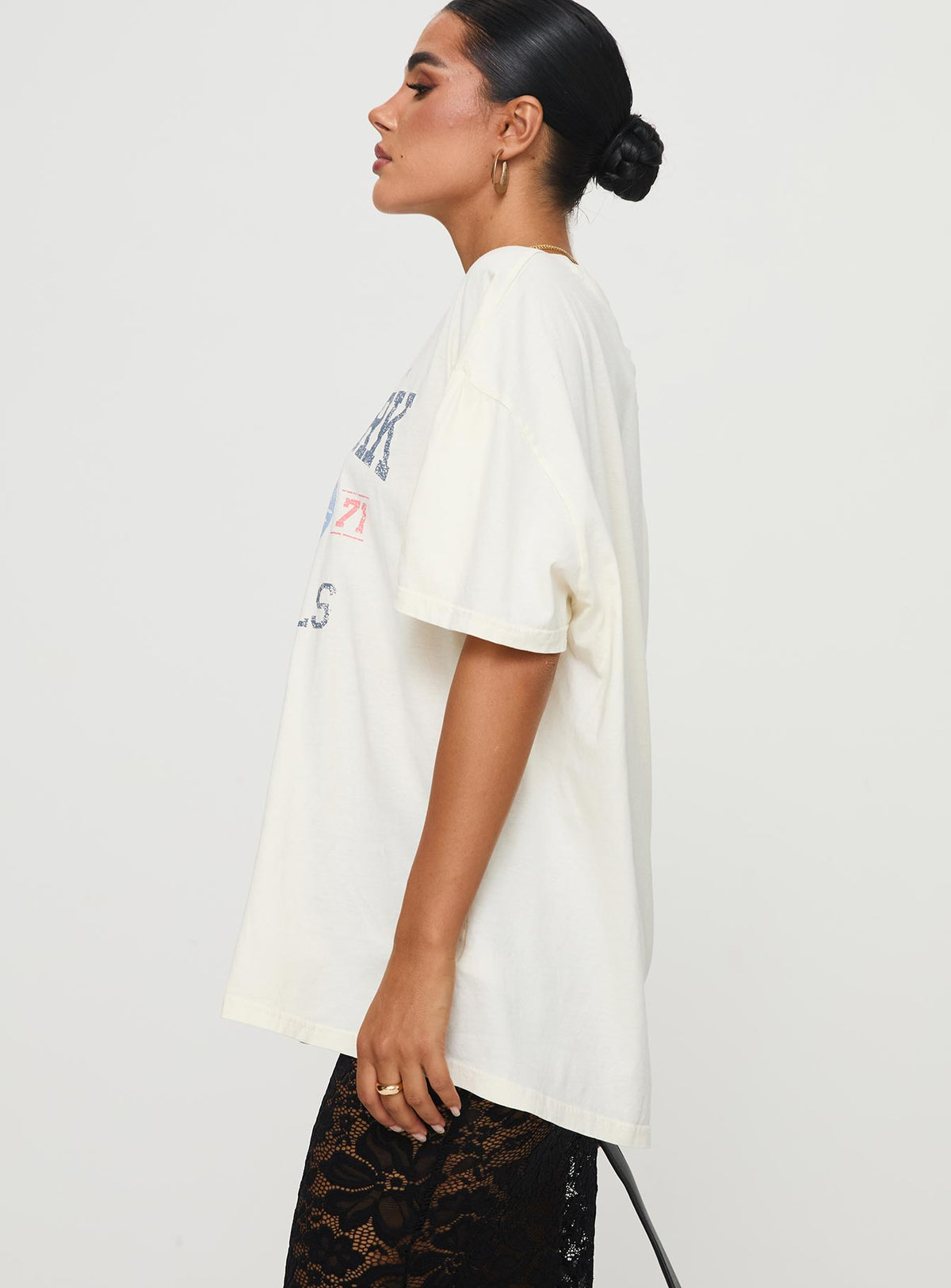 side view of model wearing Princess Polly Road Race Nationals Tee White Half Sleeves Crew Neck 