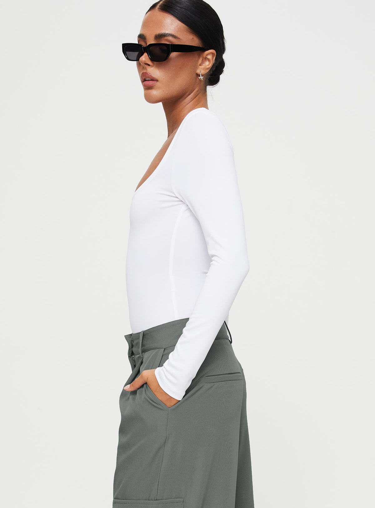 side view of model wearing Princess Polly Ellery Bodysuit White Full Sleeves Square Neck 