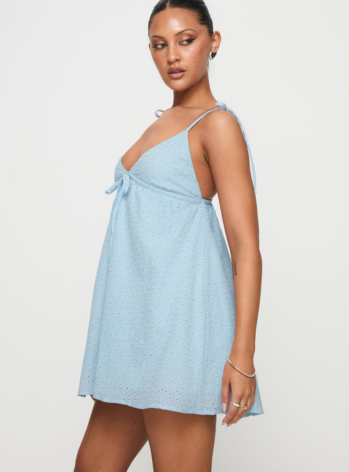 side view of model wearing Princess Polly Pavlos Mini Dress Light Blue Plunger 